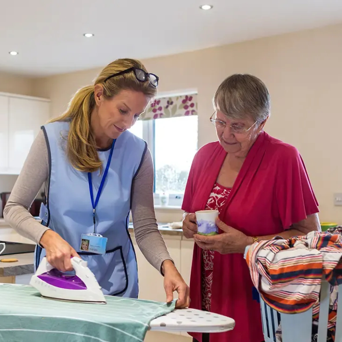 NDIS Cleaning Services Brisbane support worker cleaning a participant’s home