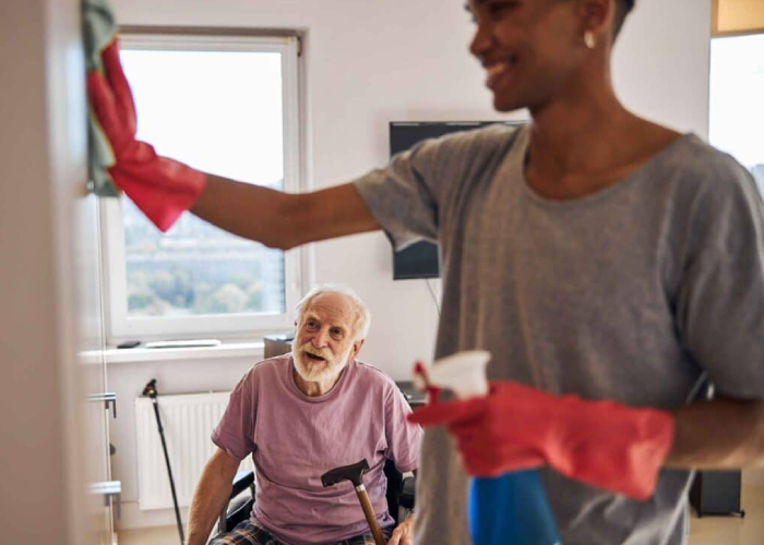 Support worker providing personalised NDIS Cleaning Services Brisbane for daily upkeep